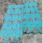 Brodé - Tissu voile suisse bleu turquoise